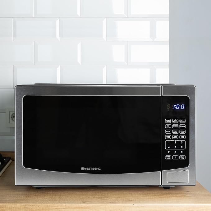 West Bend Microwave Oven 1000-Watts Compact with 6 Pre-Set Cooking Settings, Time and Weight Defrost, Electronic Control Panel and Glass Turntable, 1.1 Cu.Ft., Stainless Steel