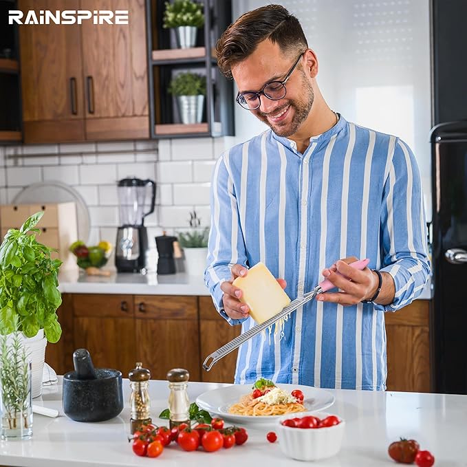 Rainspire Zester Grater with Handle, Lemon Zester Cheese Grater for Kitchen Stainless Steel, Parmesan Cheese Garlic Nutmeg Chocolate Fruits Vegetables Ginger Grater, Fine (Pink)