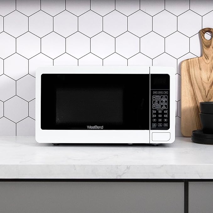 West Bend 0.7 Cu. Ft. Countertop Microwave Oven, 700W with 6 Pre-Programmed Cooking Settings, Speed Defrost, Electronic Control Panel, Rotating Glass Turntable, Add 30 Seconds Button, White